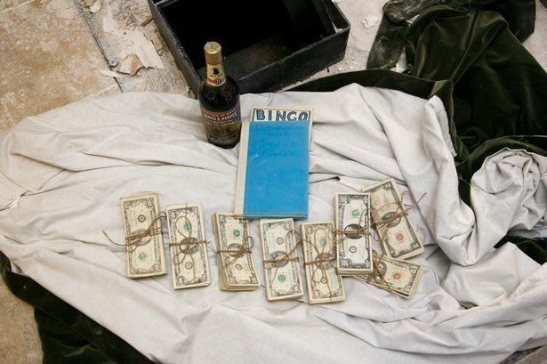 A couple found this 50-year-old safe hidden in the wall with $51,000 inside. It also held a bottle of bourbon and a book titled A Guide for the Perplexed by E.F. Schumacher.