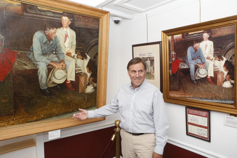 A person standing in front of a painting Description automatically generated with medium confidence